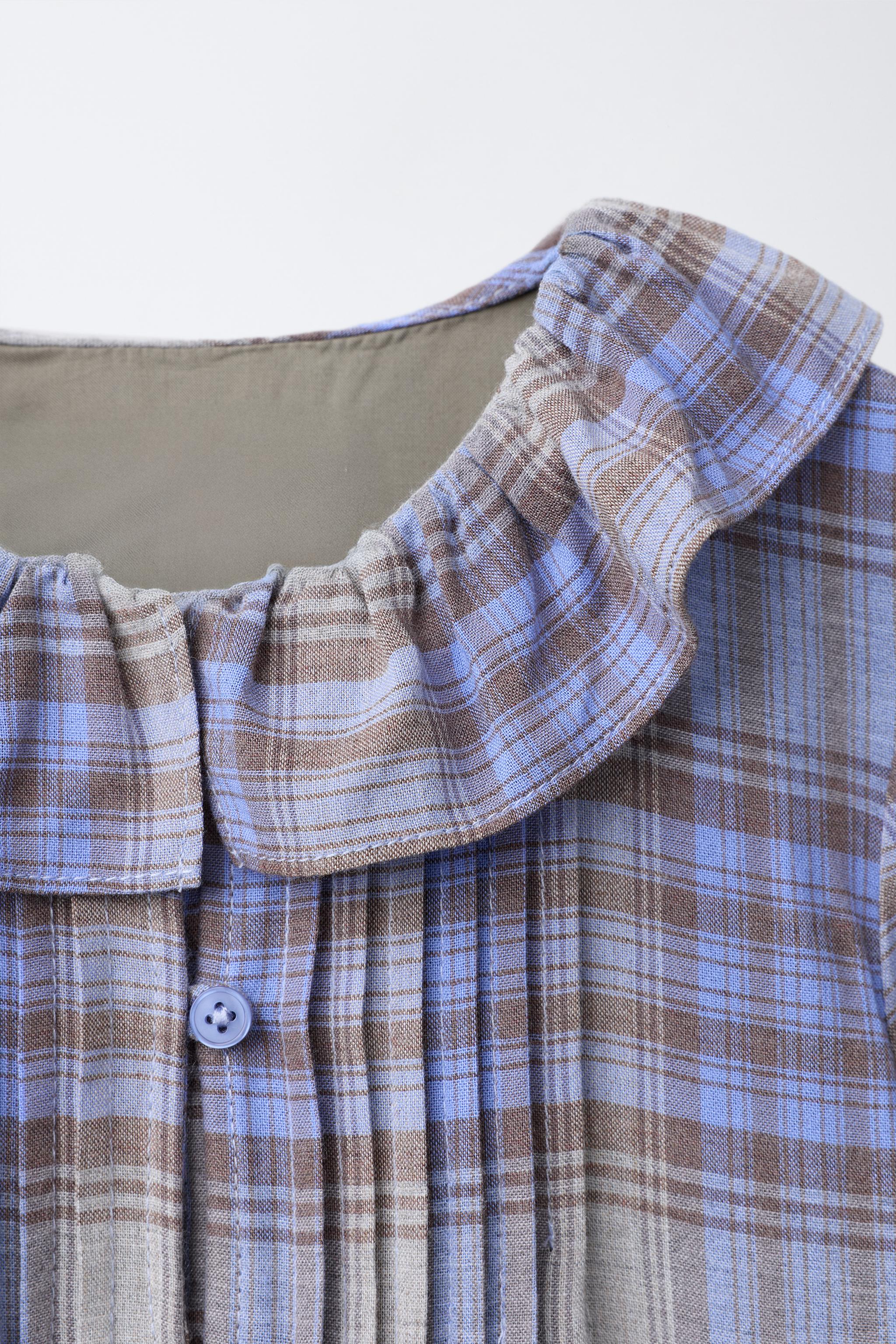 ROBE À CARREAUX AVEC PLIS NERVURÉS